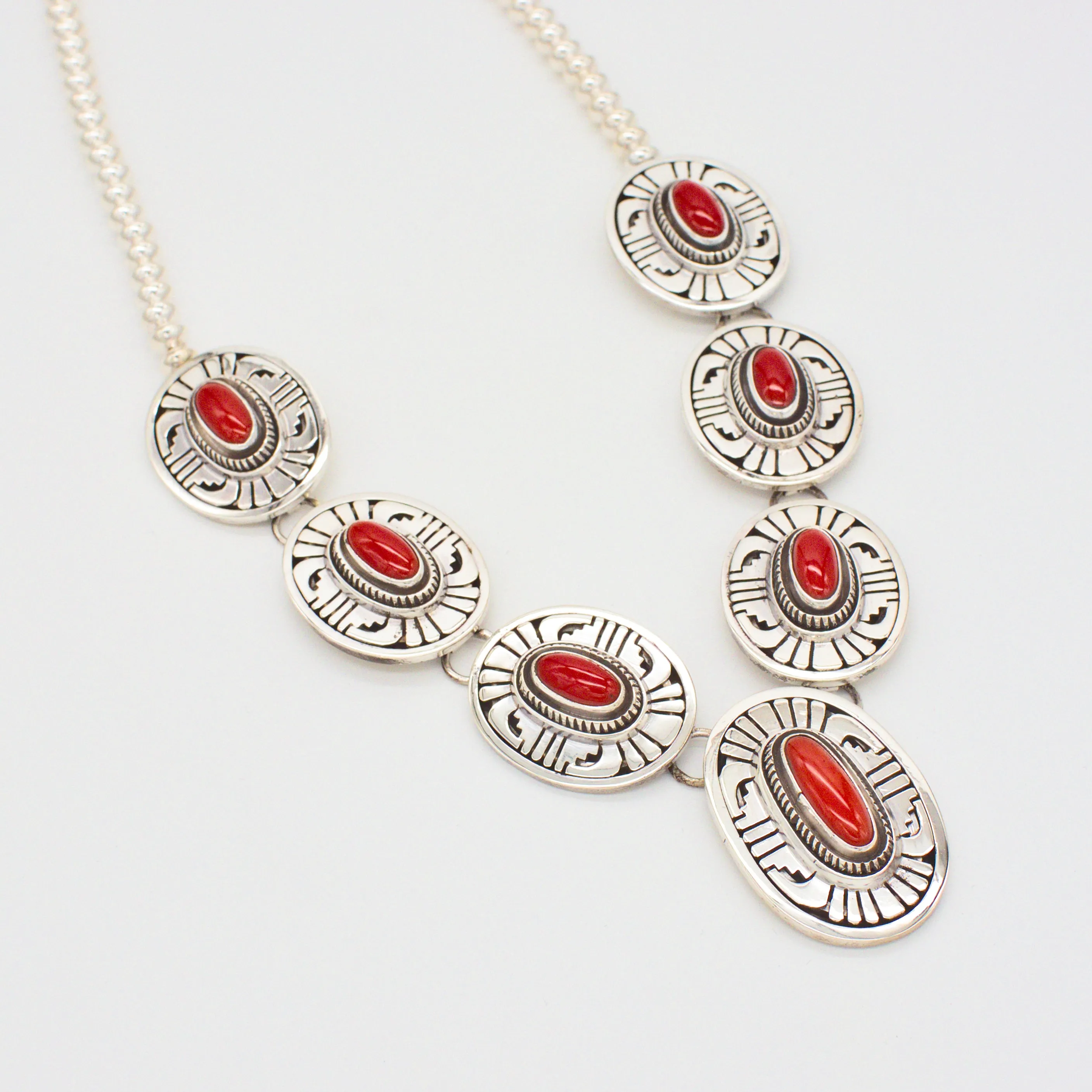 Leonard Nez Four-Piece Navajo Handmade Sterling Silver Coral Jewelry Set